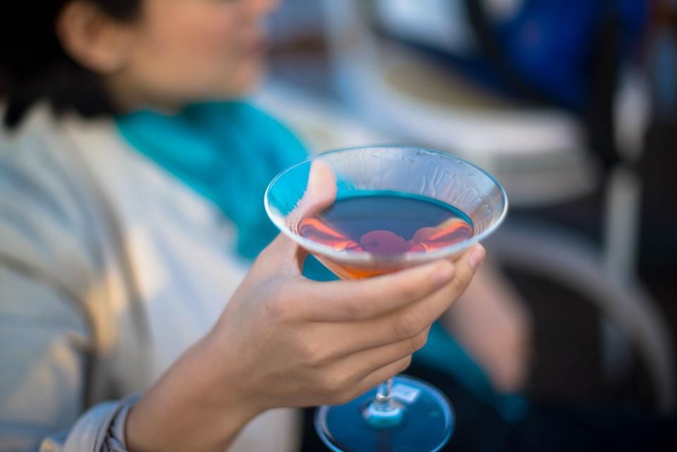 A cocktail being finished at the bar