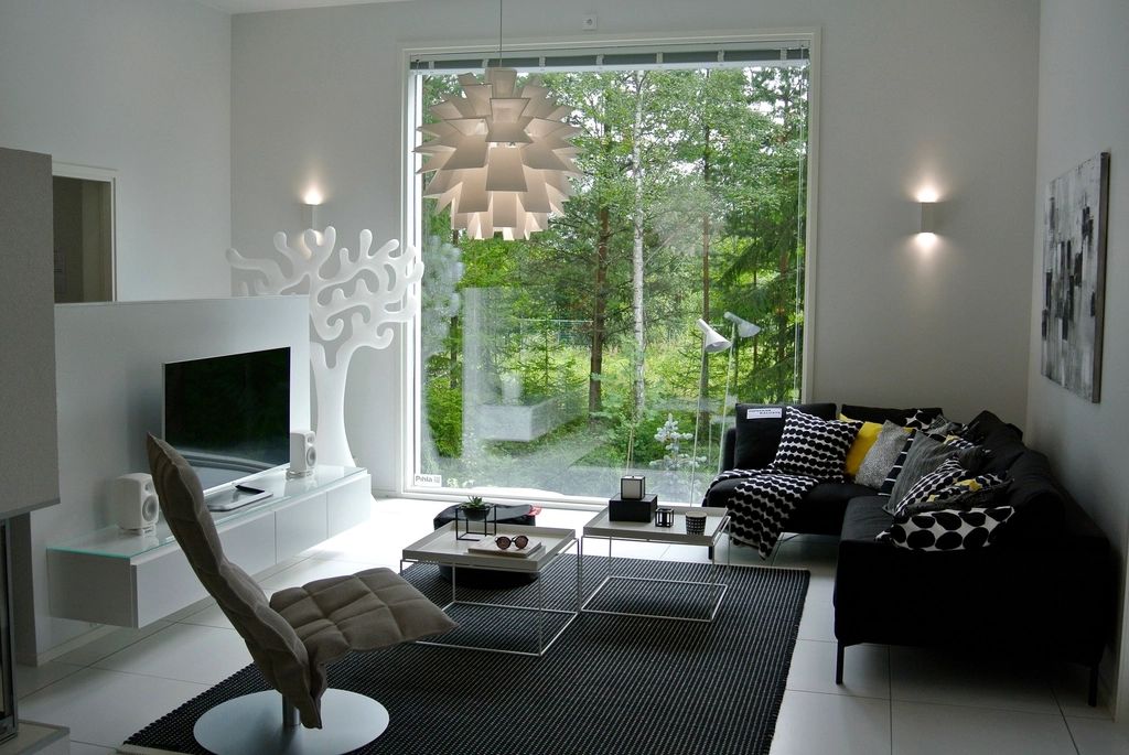 A suite sitting room with a sofa and armchairs