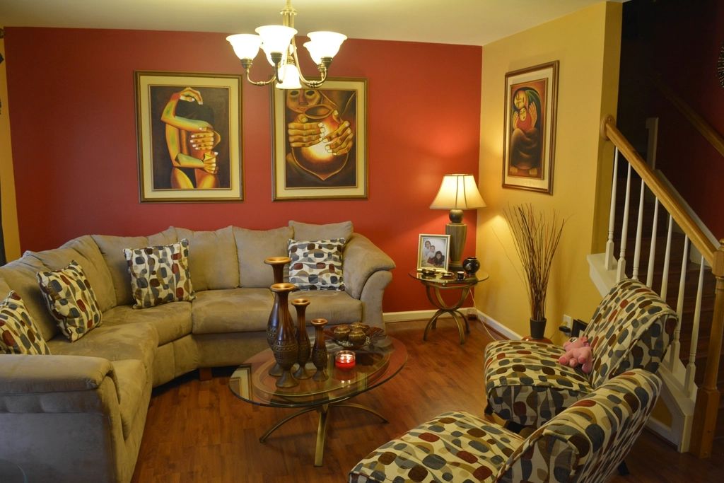 A suite sitting room with a sofa and armchairs
