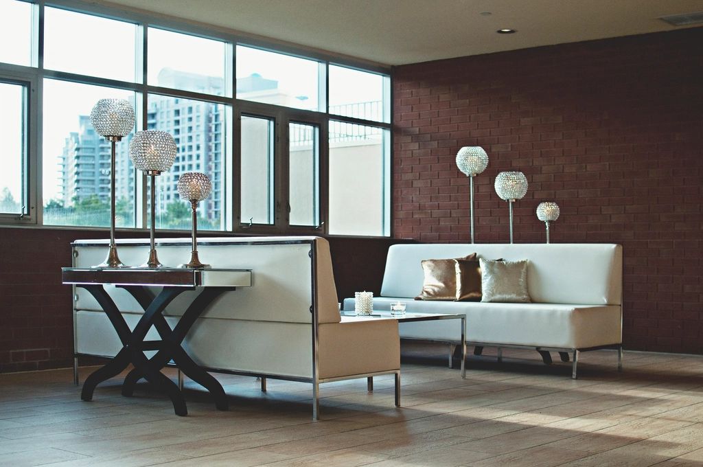 A suite sitting room with a sofa and armchairs